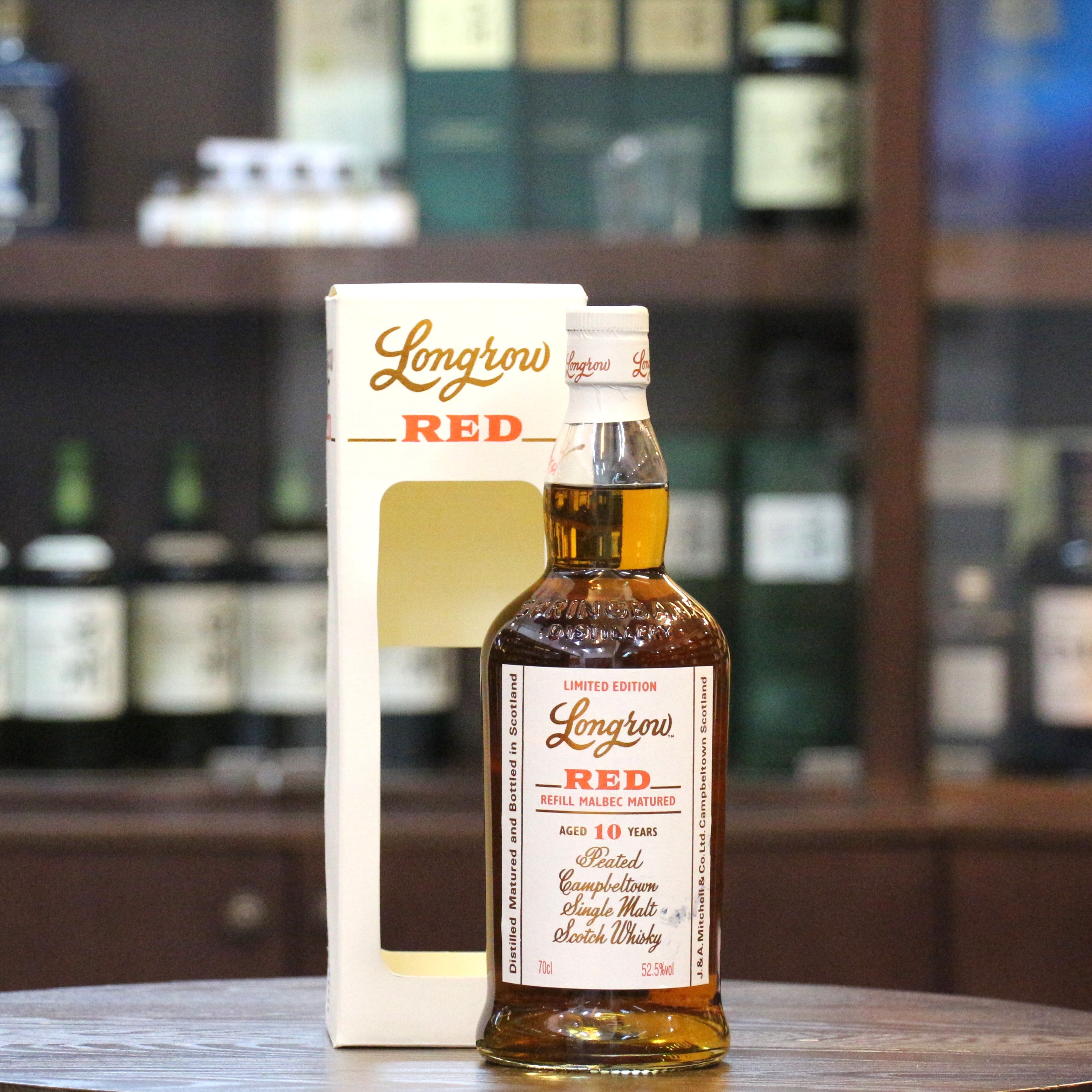 This Longrow "Red" Single Malt Scotch Whisky has been matured for 7 years in bourbon barrels followed by 3 years in refill Malbec barriques from the De Toren Private Cellar in Stellenbosch, South Africa. 10,000 bottles at cask strength were released in 2020.  Please note that the label has some stain as per the image and the cardboard carton is slightly damaged. Sold in "As Is" condition.