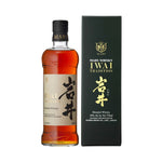 A bottle of Mars Iwai Tradition Blended Japanese Whisky with a black label and a small amount of liquid visible, alongside its packaging box.