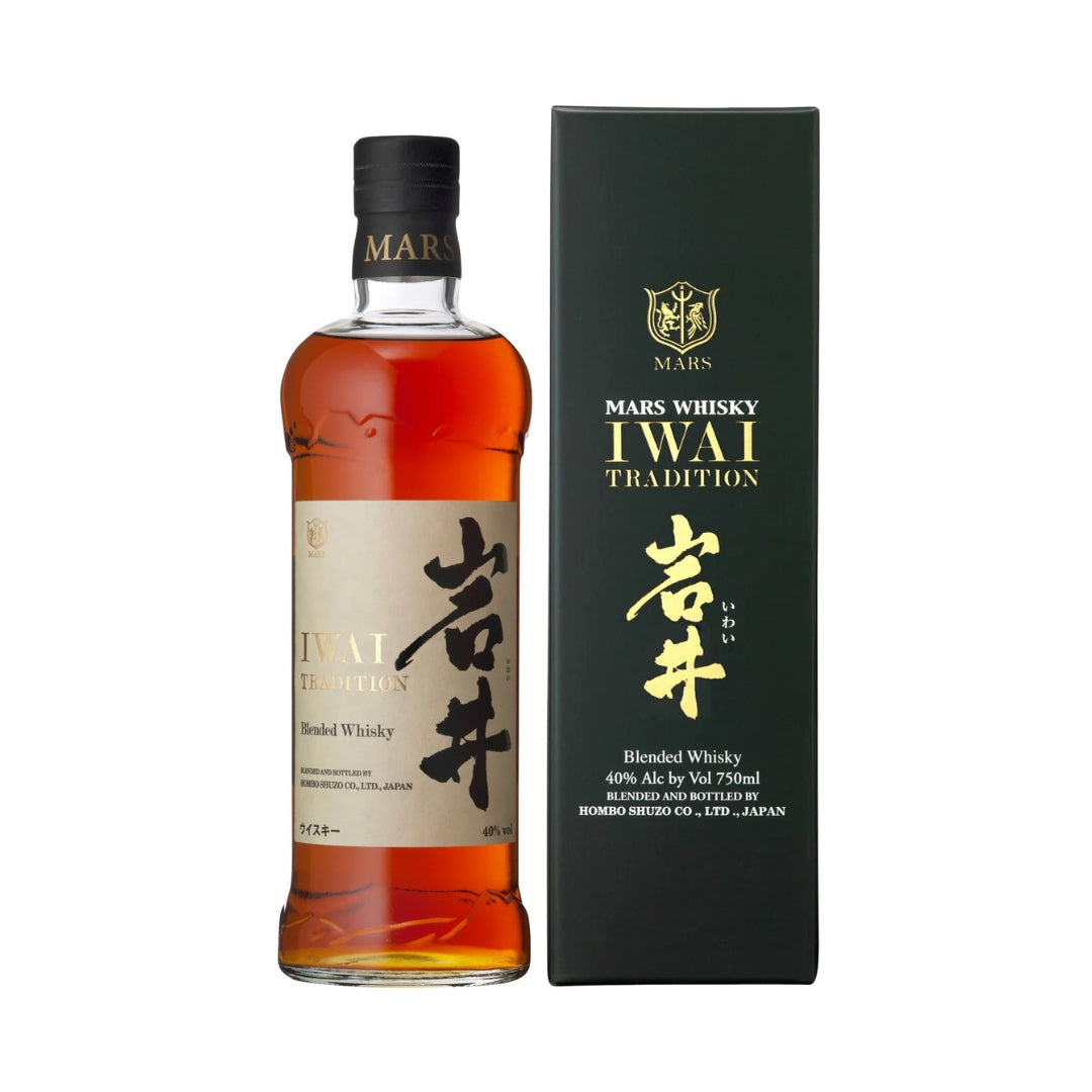 A bottle of Mars Iwai Tradition Blended Japanese Whisky with a black label and a small amount of liquid visible, alongside its packaging box.