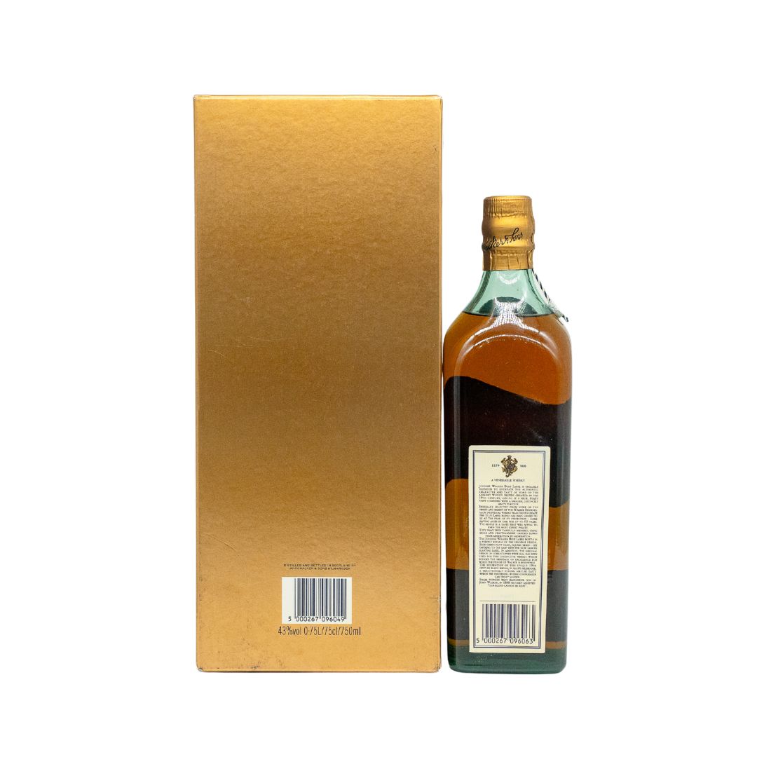 This is an early 1990s bottle of Johnnie Walker Blue Label, originally derived from the ultra‑rare “Johnnie Walker Oldest” blend that preceded the modern Blue Label expression. Blue Label is the ultimate luxury Scotch whisky, and supplies are limited by the rarity and expense of the whiskies used in the blend. Around 15 other mature and precious whiskies are added to balance Blue Label perfectly—“a blend that cannot be beat” (Alexander Walker, 1888). The label carries the Royal Warrant by Appointment to HM 