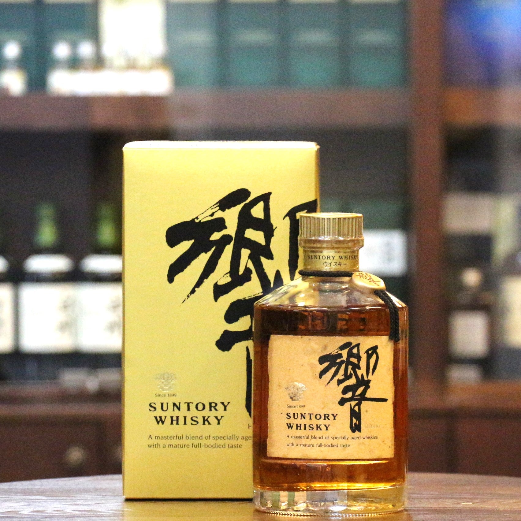 A old bottling gold box Hibiki Blended whisky bottled at 750ml.