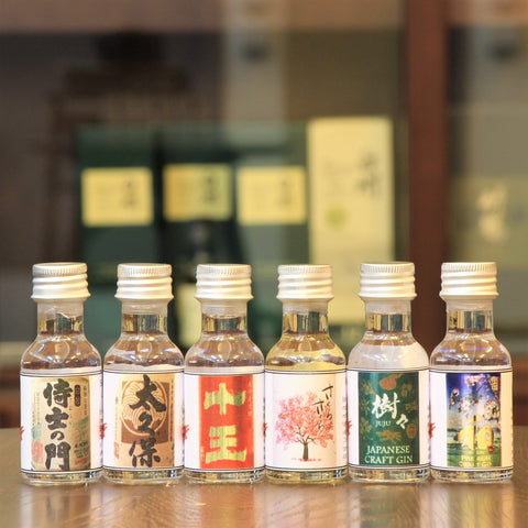 A set of 6 x 30 ml Japanese Craft Gin and Craft Shochu samples for an evening of variety and comparisons across ingredients and distilleries. This set includes the following Gin and Shochu. Full bottles for each are available at the link (JuJu Craft Gin, WA Premium Craft Gin, Juo Mugi (Barley) Shochu, Sakura Sakura Aged Shochu in Sakura Barrel, Samurai No Mon, Ookubu).